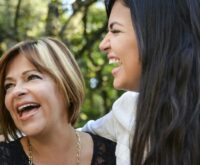 Cheerful mother and young daughter