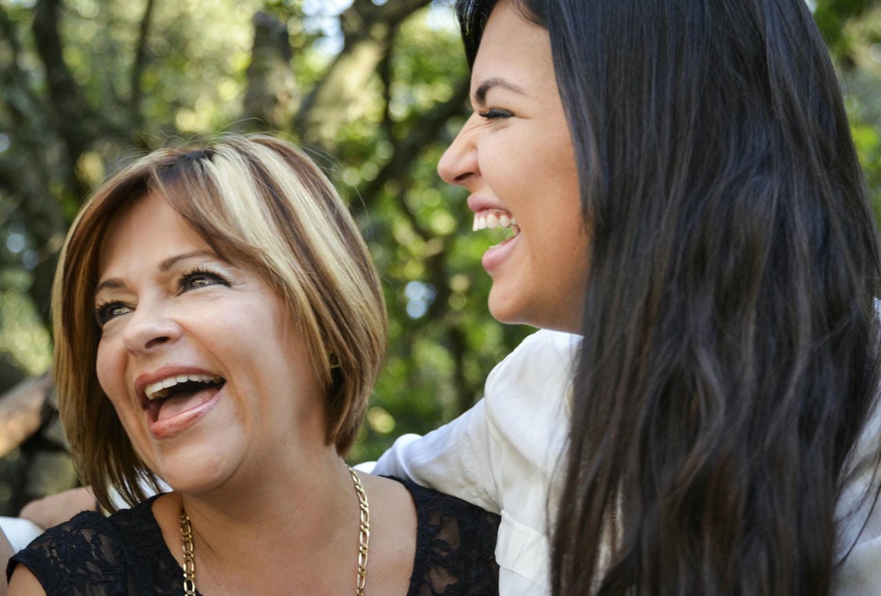 Cheerful mother and young daughter